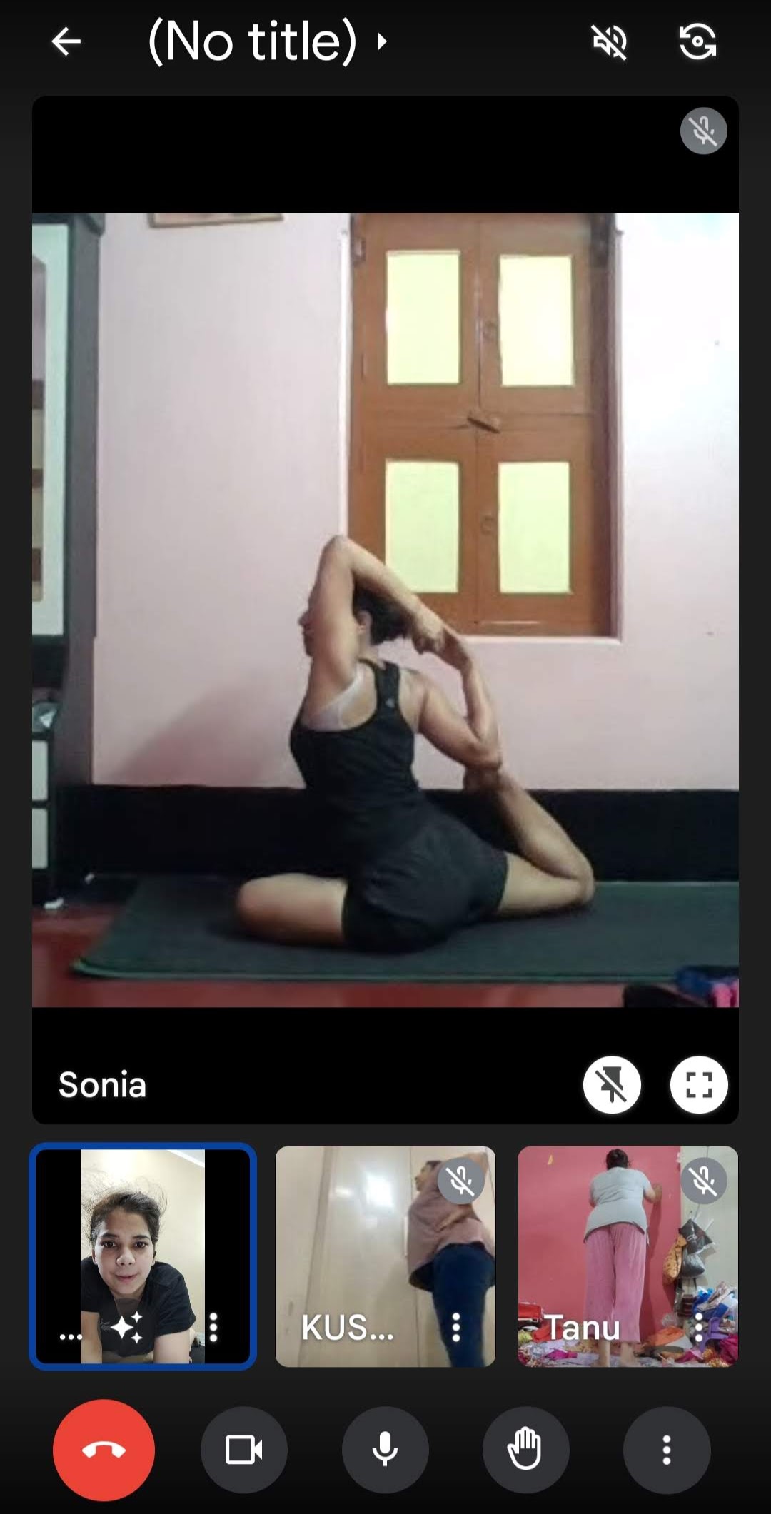 A student performing a backbend pose during an online yoga session.