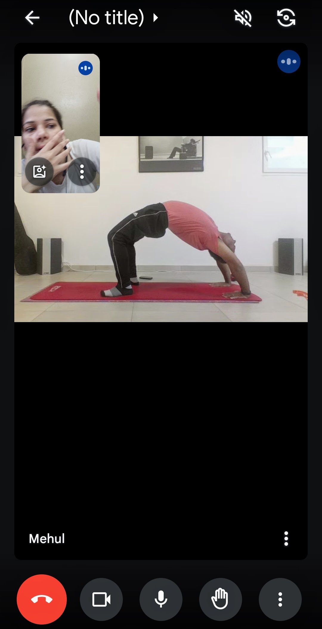 A student receives coaching for Chakrasana (Wheel Pose) in an online class.